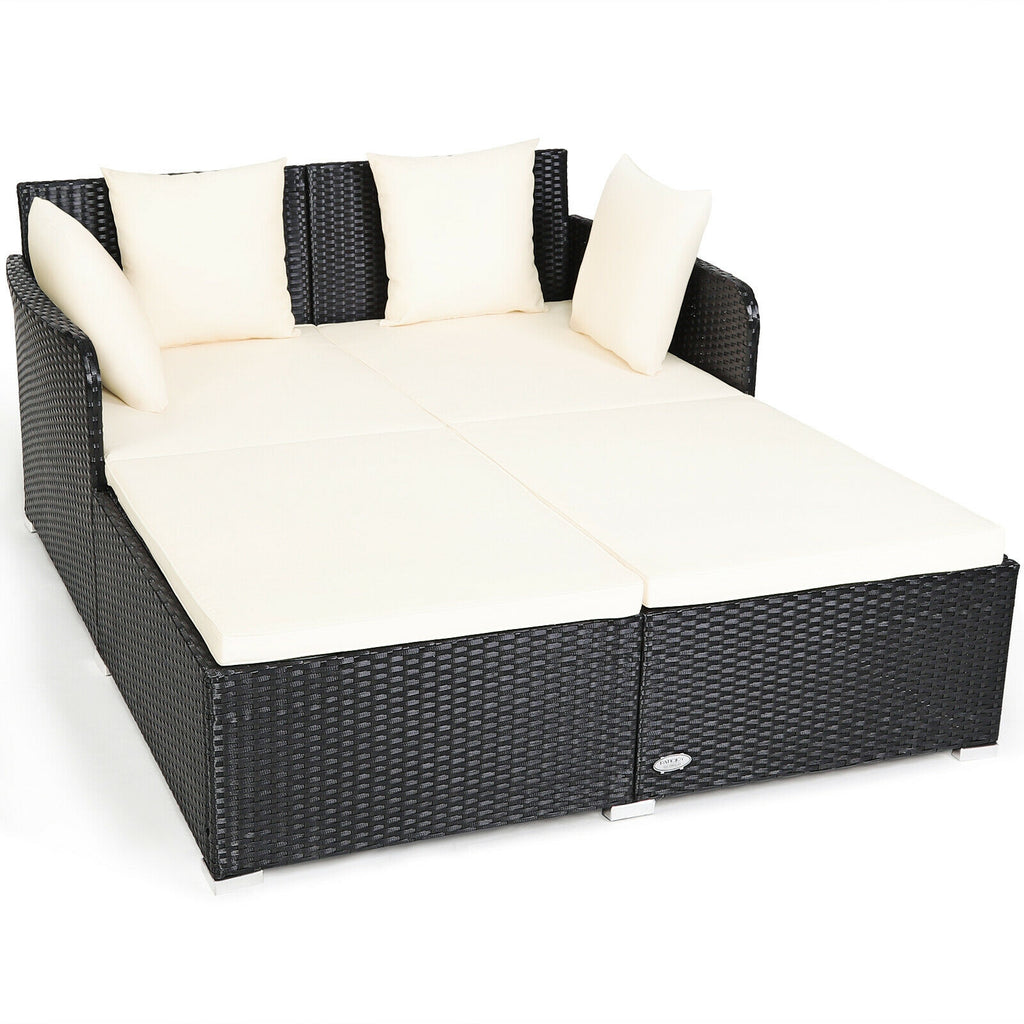 Spacious Outdoor Rattan Daybed with Upholstered Cushions and Pillows