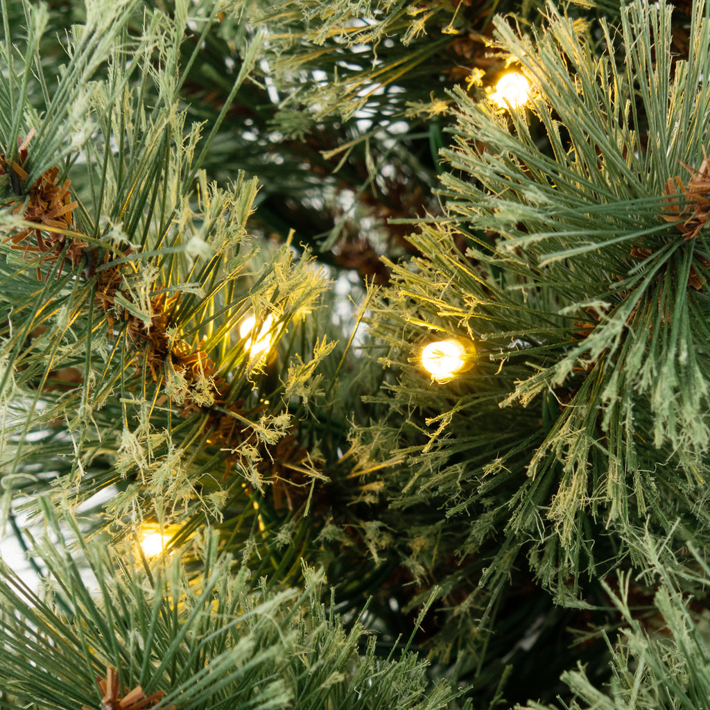 Pre-Lit Potted Christmas Tree with LED Lights and Antique Urn Base
