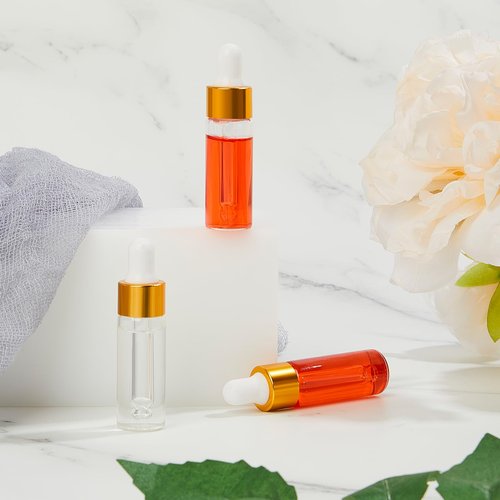Didaey 200 Pcs Mini Glass Oil Dropper Bottle Bulk, Clear Essential Small Empty Bottles Sample Containers Perfume Liquid Vials with Cap for Traveling (5 ml,Gold)