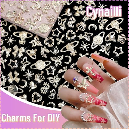 180 Pcs Gold Nail Charms and Gems, Bow Star Butterfly Cross Alloy Nail Jewelry, 18 Styles Metal Planet Heart Y2K Gold Nail Charms for Nails Art Design