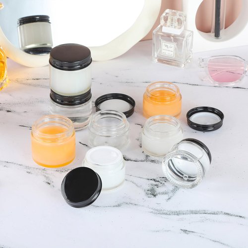 RAMFIYN 12 Pack 1oz Clear Glass Jars Small Glass Containers with Black Metal Lids Empty Cosmetic Jars with Inner Liners and Lids Clear Glass Lotion Jars with Labels for Traveling