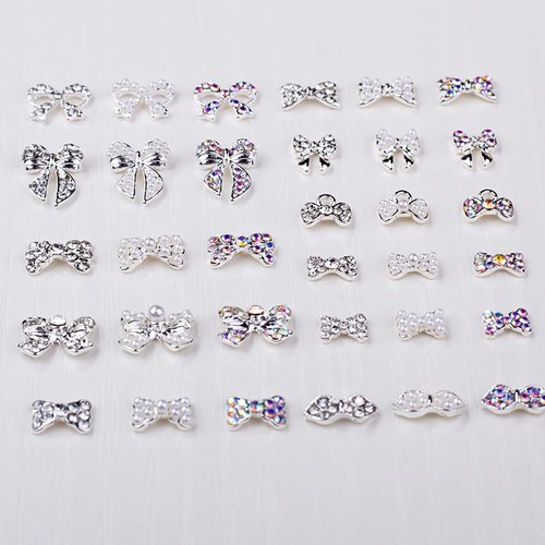 JERCLITY 33 Pcs Silver Alloy Bow Charms for Nails Bow Nail Charms Gems Bowknot Nail Studs Inlaid Pearl Clear Iridescent Rhinestone for Women Nail Art