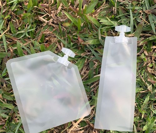 NATX 50Pcs 0.17oz Matte Cream Shampoo Perfume Cosmetic Liquid Spout Pouches Heat Seal Portable Travel Liquid Clear Plastic Empty Packaging Bag Divide bag 5ml
