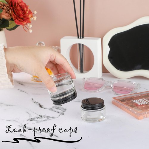 RAMFIYN 12 Pack 1oz Clear Glass Jars Small Glass Containers with Black Metal Lids Empty Cosmetic Jars with Inner Liners and Lids Clear Glass Lotion Jars with Labels for Traveling