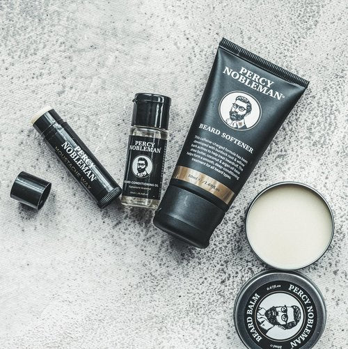 Percy Nobleman Beard Survival Kit, a Beard Grooming Kit containing a scented beard oil, beard balm, moustache wax, and a beard softener