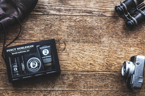Percy Nobleman Beard Survival Kit, a Beard Grooming Kit containing a scented beard oil, beard balm, moustache wax, and a beard softener
