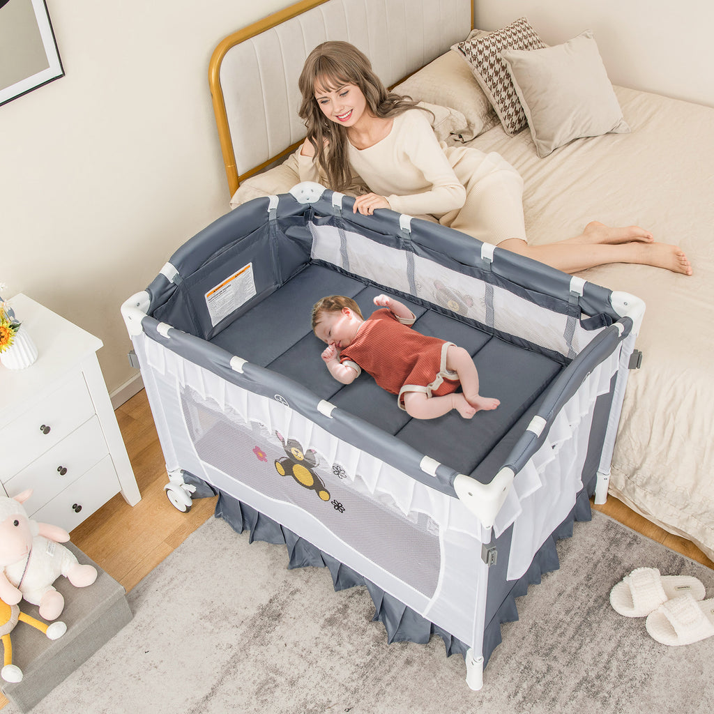 Gray Convertible Baby Bassinet with Removable Changing Table and Mesh Canopy